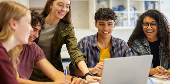Students Students work together on a laptop