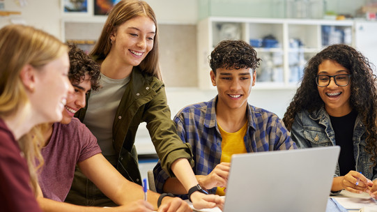Students Students work together on a laptop